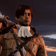 Daniel Yatsu stares off into the sunset with his gun over his shoulder while he wears a survey corps uniform.